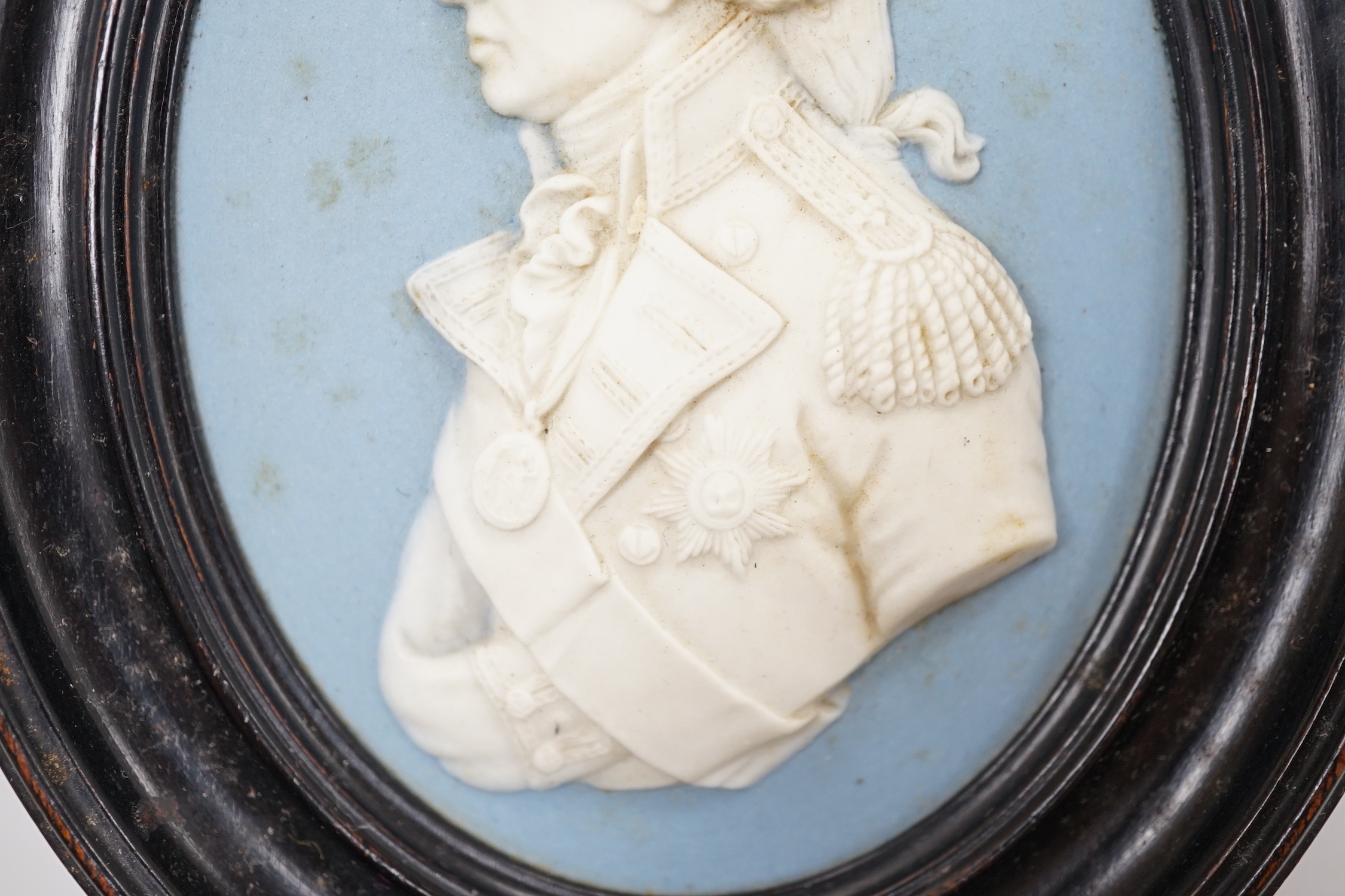 A framed Wedgwood Blue Jasper plaque, Lord Nelson, Frame 13.5cm high